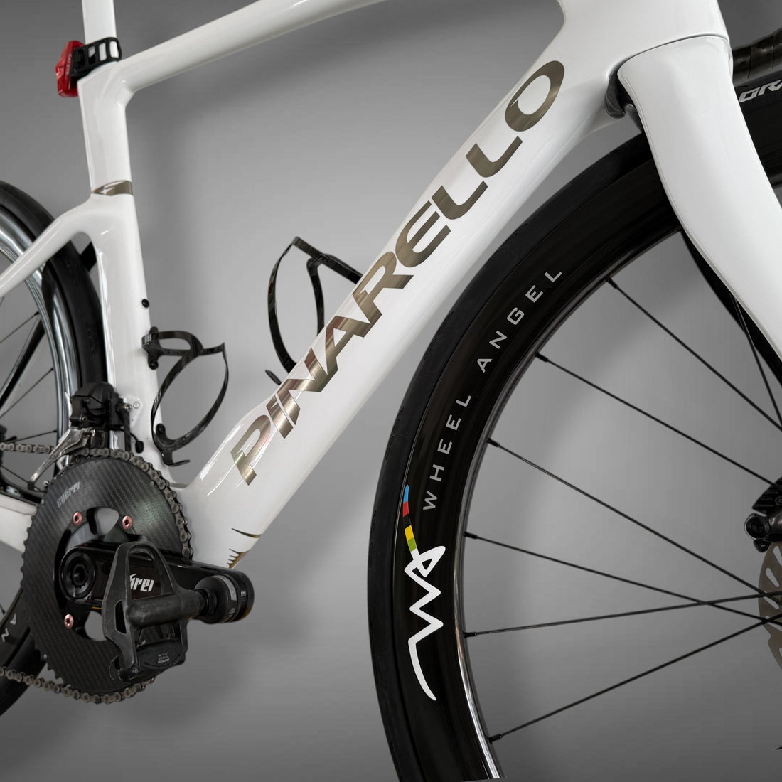 Close up of Pinarello F frame with Wheel Angel SLR 49 carbon rim and custom decals
